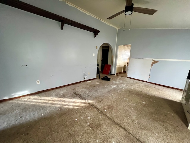 spare room with ceiling fan and vaulted ceiling