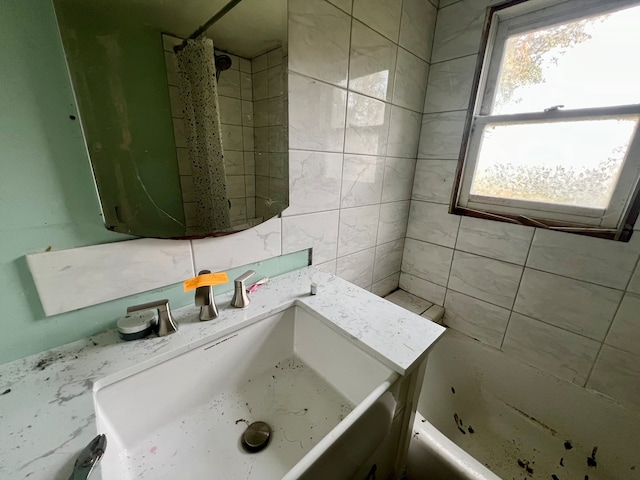 bathroom featuring sink and shower / bathtub combination with curtain