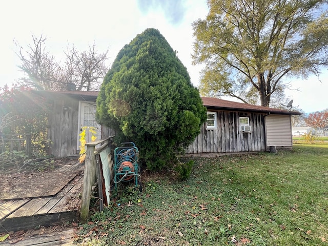 exterior space with a lawn and cooling unit