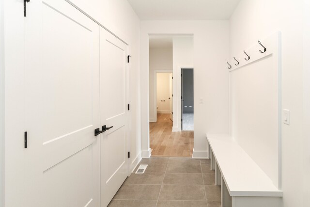 mudroom featuring light tile patterned floors