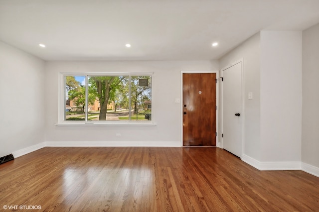 empty room with wood-type flooring