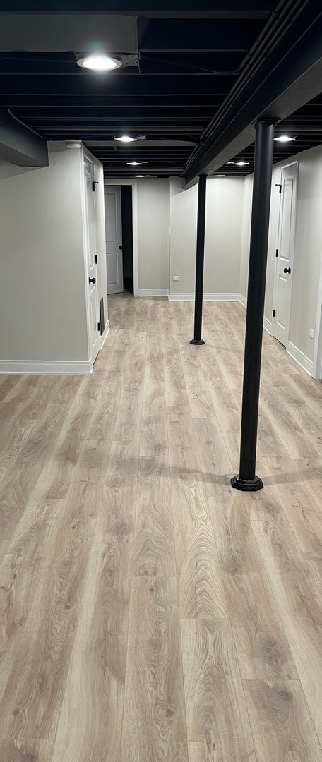 basement featuring light hardwood / wood-style flooring