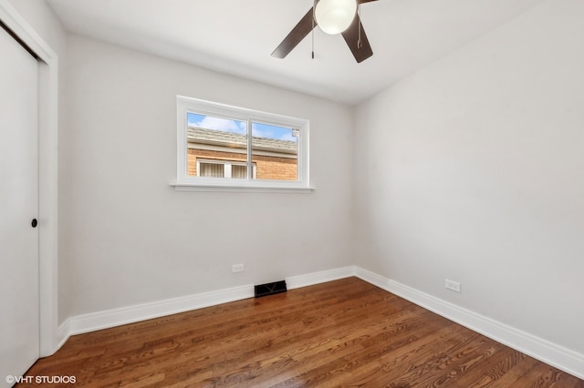 spare room with ceiling fan and wood-type flooring