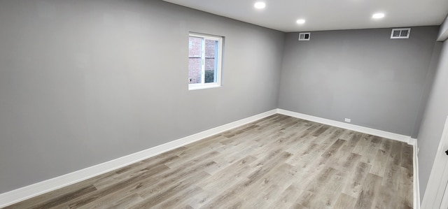 empty room with light hardwood / wood-style floors