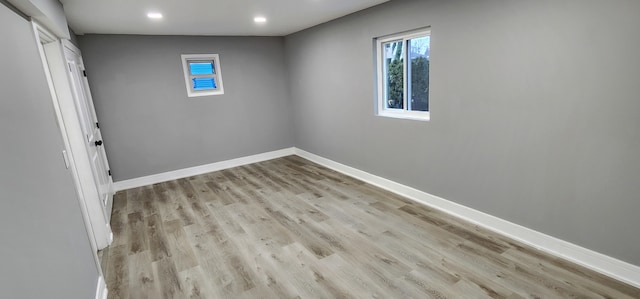 spare room with light wood-type flooring