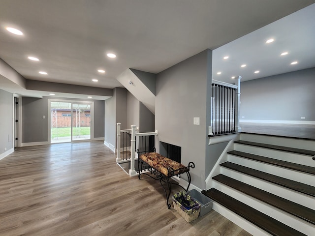 stairway featuring hardwood / wood-style floors