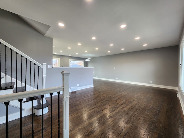 unfurnished room with dark hardwood / wood-style floors and a notable chandelier