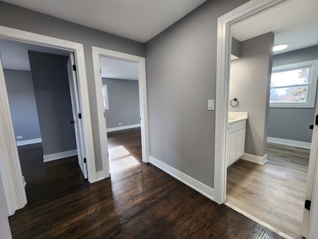 hallway featuring dark wood-type flooring