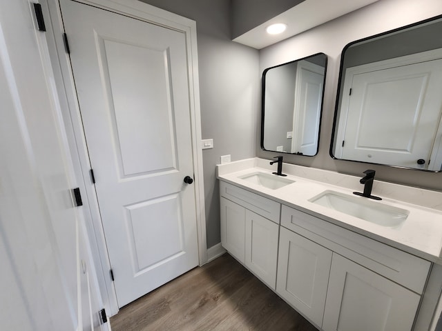 bathroom featuring vanity and hardwood / wood-style flooring