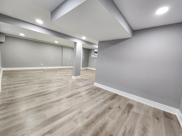 basement featuring light wood-type flooring