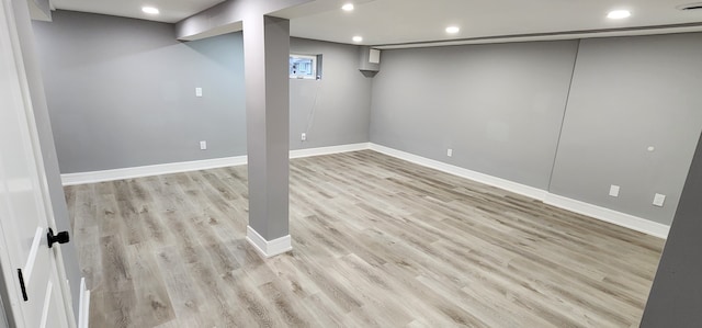 basement featuring light hardwood / wood-style floors