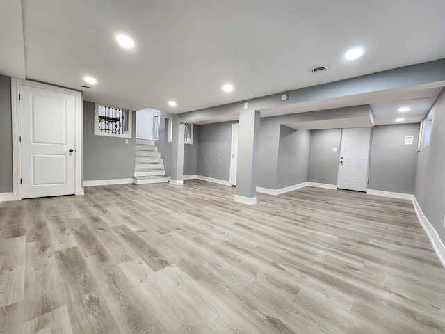 basement featuring light wood-type flooring