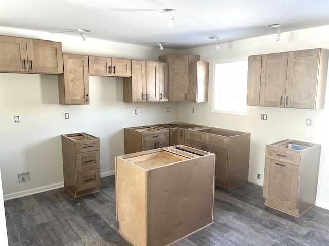 kitchen with dark wood-style floors and baseboards