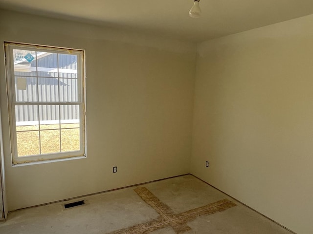 spare room with visible vents and plenty of natural light