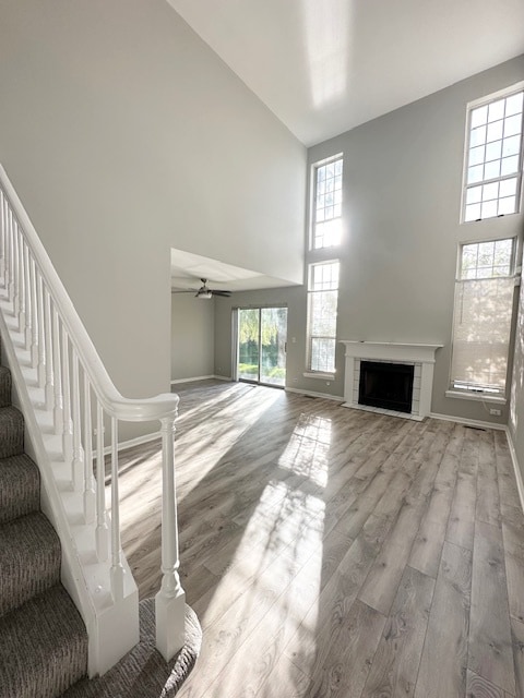 interior space with ceiling fan and light hardwood / wood-style flooring