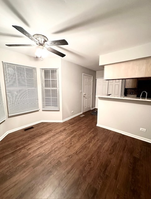 empty room with hardwood / wood-style flooring and ceiling fan