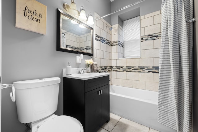 full bathroom featuring shower / bath combo with shower curtain, tile patterned flooring, vanity, and toilet