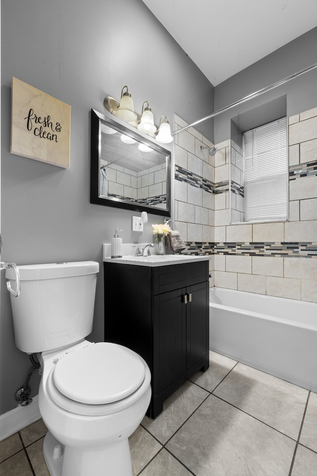 full bathroom with tile patterned floors, vanity, toilet, and tiled shower / bath