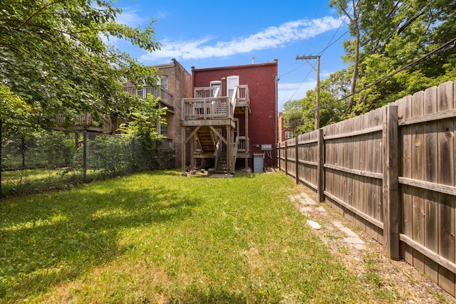 view of yard with a wooden deck