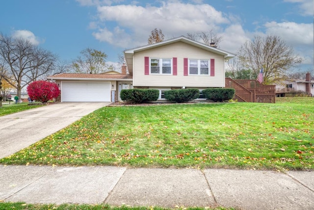 view of front of house with a garage and a front lawn