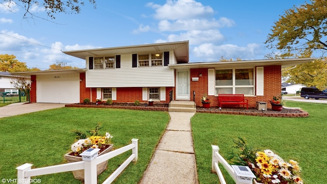 tri-level home with a front lawn and a garage