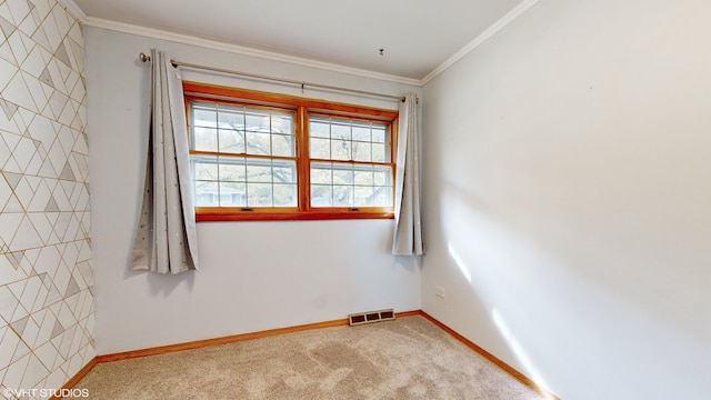 carpeted spare room with ornamental molding