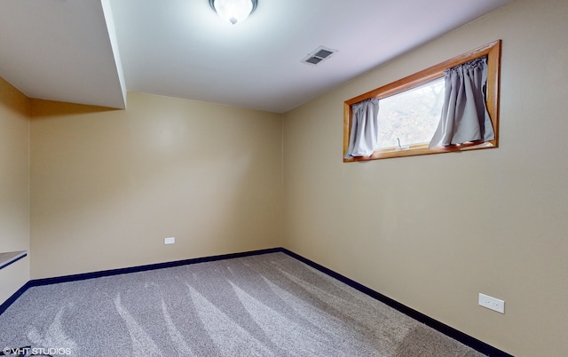 empty room with carpet flooring