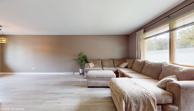 living room with light hardwood / wood-style floors