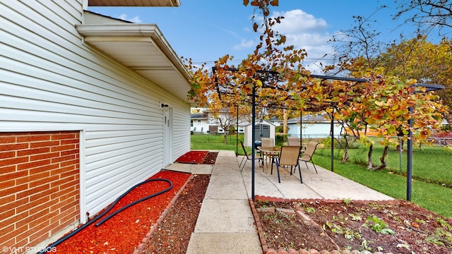 view of patio / terrace with an outbuilding