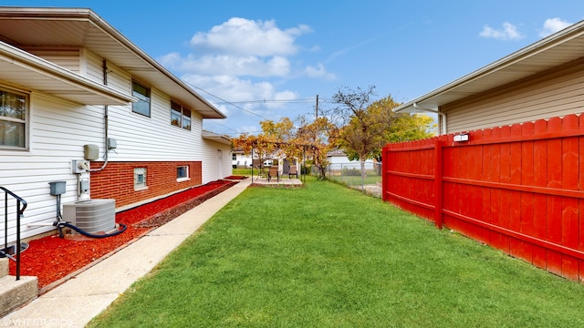 view of yard featuring central AC