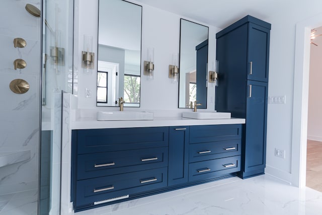 bathroom featuring walk in shower and vanity