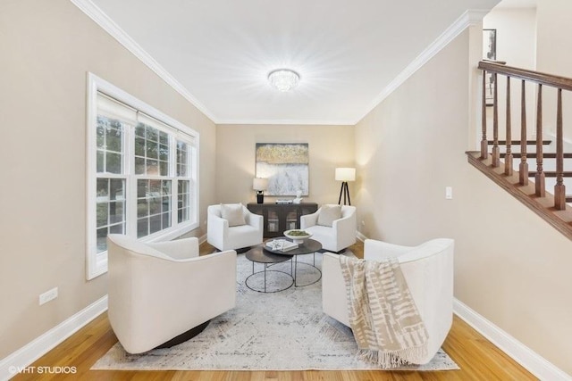 living room with hardwood / wood-style flooring and crown molding