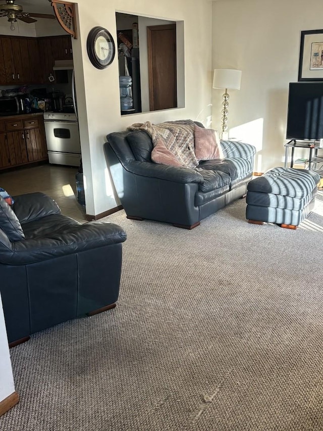 living room with carpet flooring and ceiling fan