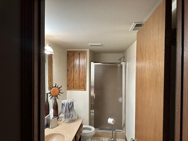 bathroom with vanity, toilet, and walk in shower