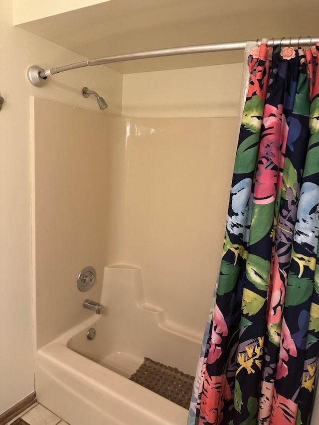 bathroom featuring shower / tub combo and tile patterned floors