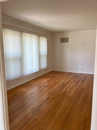 empty room featuring hardwood / wood-style floors