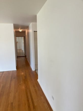 hallway featuring hardwood / wood-style flooring