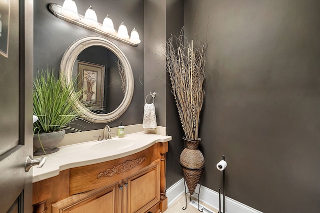 bathroom with vanity and baseboards