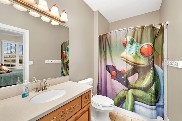 full bathroom with vanity, toilet, and tile patterned floors
