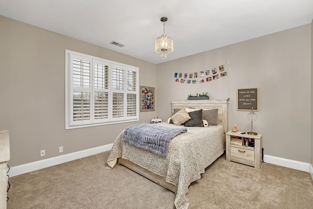 bedroom with visible vents, baseboards, and carpet flooring