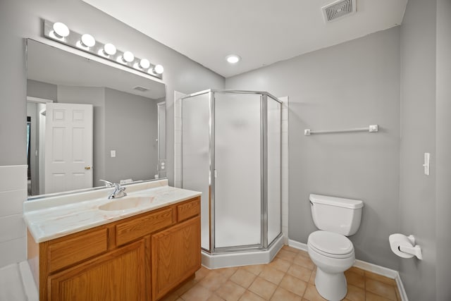 bathroom featuring vanity, tile patterned flooring, toilet, and an enclosed shower