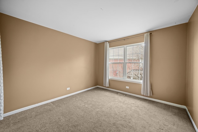 empty room with carpet flooring