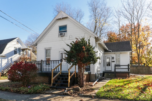 bungalow-style house with cooling unit