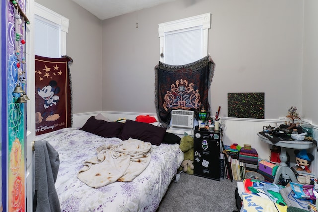 bedroom with cooling unit and carpet