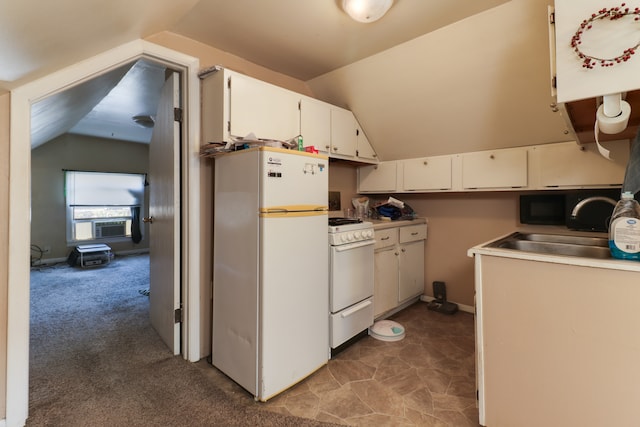 kitchen featuring white cabinetry, light carpet, white appliances, and vaulted ceiling