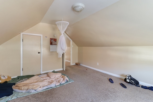 bonus room featuring lofted ceiling and carpet