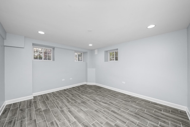 basement featuring dark hardwood / wood-style flooring