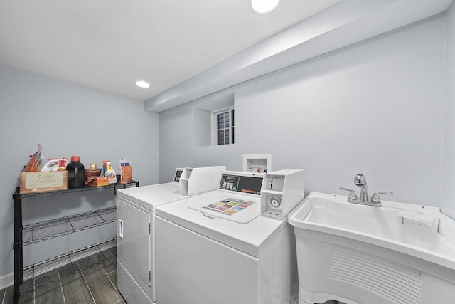 laundry area with washing machine and dryer and sink