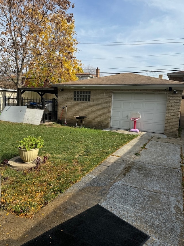 exterior space featuring a garage and a yard