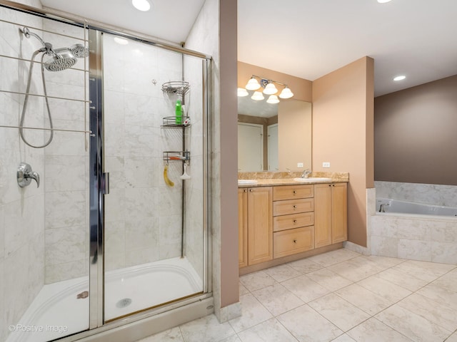 bathroom featuring vanity, tile patterned floors, and plus walk in shower